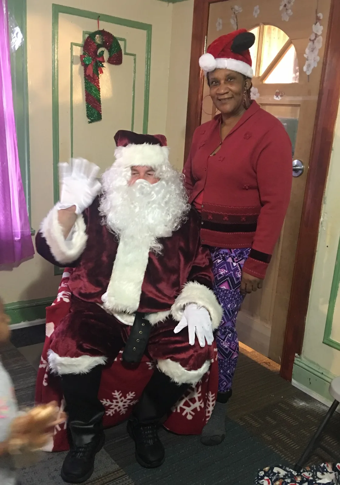 Caregiver supporting a seasonal daycare celebration